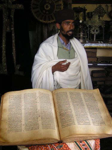 Ethiopian priest with 1000 year old goatskin chanting book ©Venus Adventures Ltd