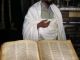 Ethiopian priest with 1000 year old goatskin chanting book ©Venus Adventures