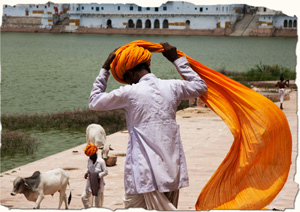 Man tying turban, India